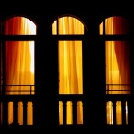 Windows--let, orange curtains